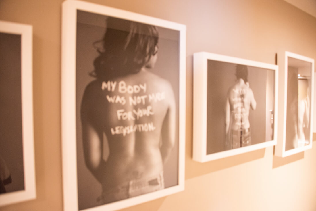 Feminist art at Hotel Zena in Washington DC - the print in focus has the words "My body was not made for your legislation" across a woman\'s bare back