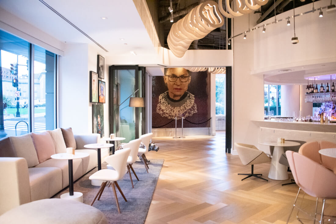 The lobby area of Hotel Zena with the Notorious RBG portrait at the far end