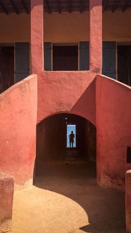 Orange building entrance in Goree island - photo by Larissa Rolley, photography course creator at Wanderful