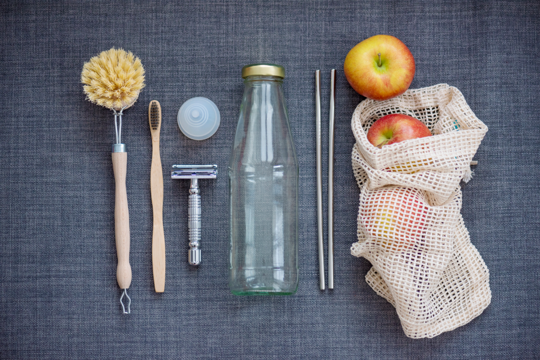 Sustainably made items, including bamboo products, cloth produce bag, glass bottle and metal straws