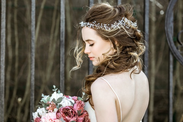 Easy DIY Bridesmaid Hairstyles | If you're looking for the perfect updo or half up bridesmaid hair ideas for medium length or long hair, we've rounded up 10 simple styles you can create at home. Perfect for brunettes and blondes, straight hair, curly hair, and hair with natural waves, these classic, vintage, and boho updos will take your look from good to gorgeous in time for summer wedding season!