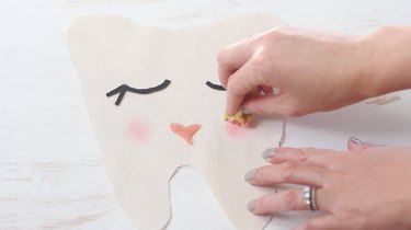 Painting cheeks on fabric