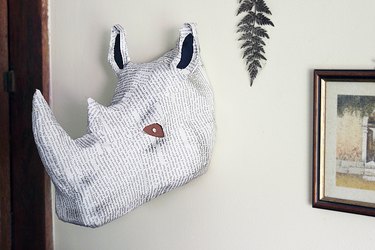 rhino bust hanging on wall