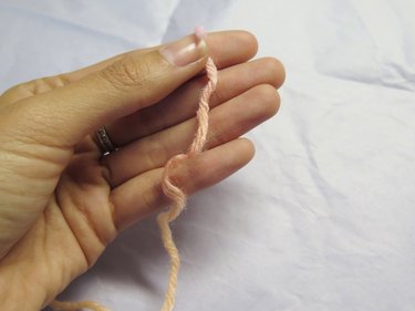 Grab the end of the yarn to start wrapping.