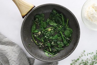 Cook spinach and garlic