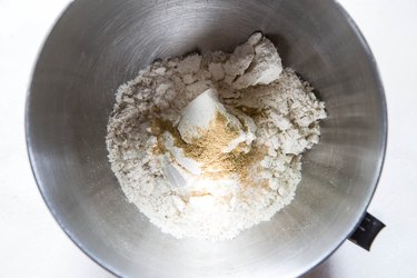 corn masa, salt and cumin in a mixing bowl.