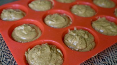 Batter in muffin pan for pumpkin oat flour blender muffins