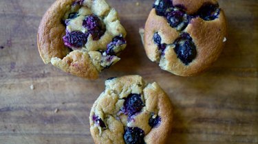 Nut butter banana muffins with almond butter and topped with blueberries