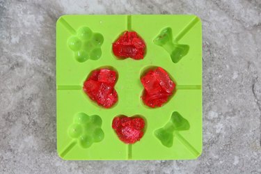 Fill the heart mold with candy