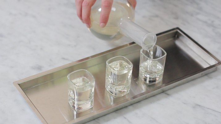 Pouring gelatin mixture into shot glasses