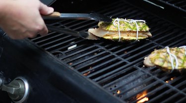 Placing pineapple planks on hot grill
