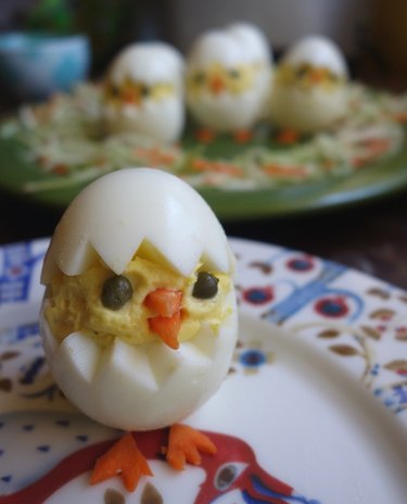 Deviled egg Easter chicks on plate.