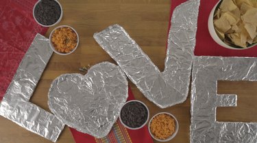 Cardboard letters covered in foil.