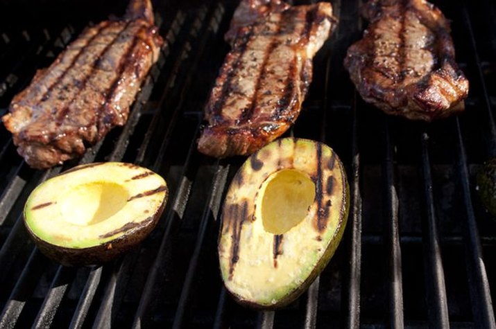 steaks and avocados on the grill