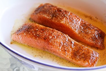 Raw salmon with oil and seasoning