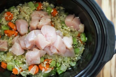 Crock pot with vegetables, rice, and chicken