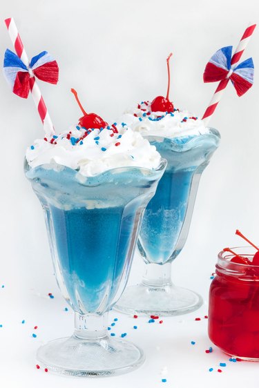 Red, white and blue ice cream floats with patriotic straws